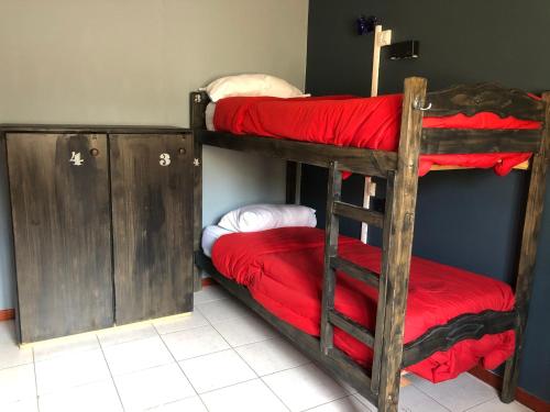 Hostel Olimpo House客房内的一张或多张床位