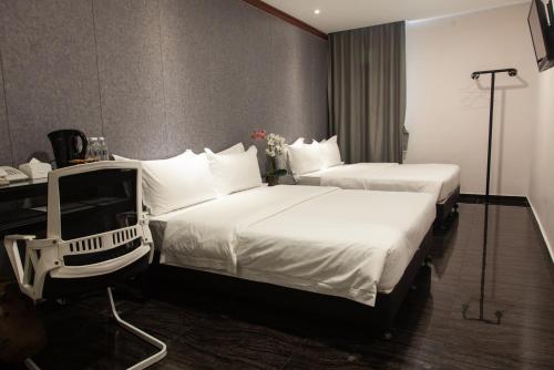 M Design Hotel @ Taman Pertama客房内的一张或多张床位
