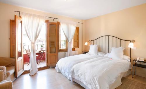 林工特拉斯帕拉西奥酒店客房内的一张或多张床位