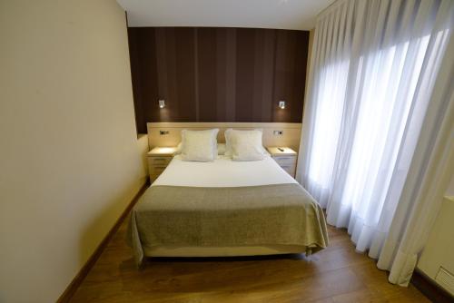 利亚内斯旅游公寓酒店客房内的一张或多张床位