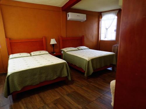 Posada "Inkali" Xilitla客房内的一张或多张床位