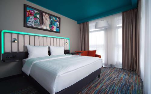 里加瓦德马拉丽柏酒店客房内的一张或多张床位