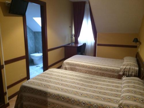 Hotel Nueva Allandesa客房内的一张或多张床位