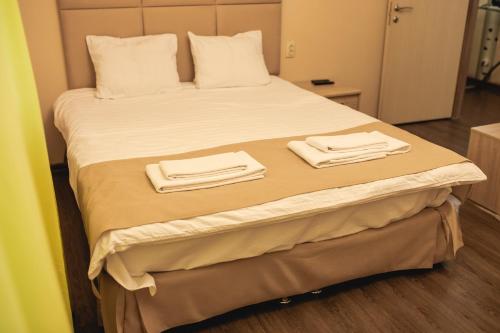 Traveler's Mini-Hotel客房内的一张或多张床位