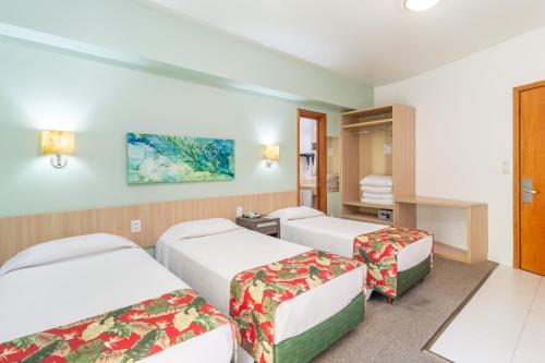 Eko Residence Hotel - a 200m dos Hospitais da Santa Casa客房内的一张或多张床位