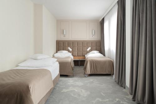 Grand Chotowa Hotel Spa & Resort客房内的一张或多张床位