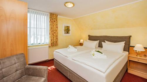 努斯巴姆霍夫伽尼酒店客房内的一张或多张床位