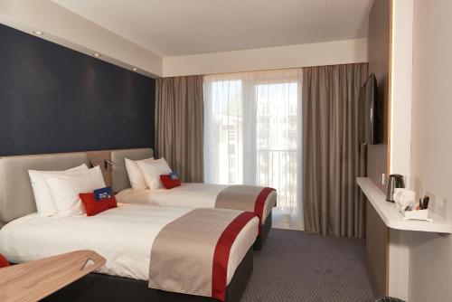 阿姆斯特丹快捷智选假日酒店客房内的一张或多张床位