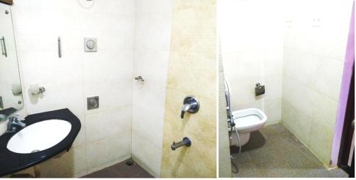 科鲁鲁Abimon Residency Kollur的一间带水槽和卫生间的浴室