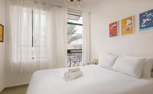Sapir Boutique Apartments客房内的一张或多张床位