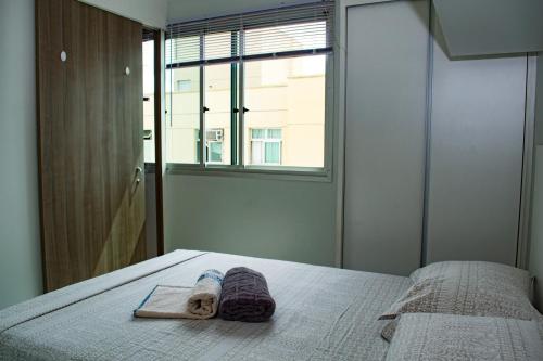 Kit Net - Vila Verde Sudoeste客房内的一张或多张床位