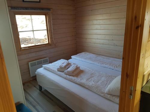 Stundarfriður cottages客房内的一张或多张床位