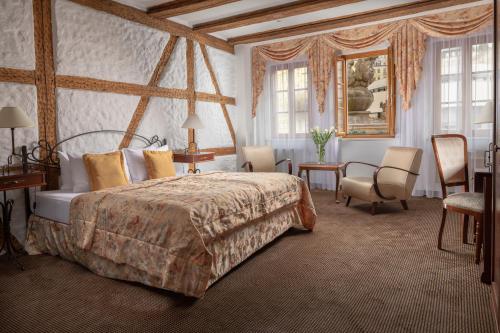 Promenáda Romantic Hotel客房内的一张或多张床位