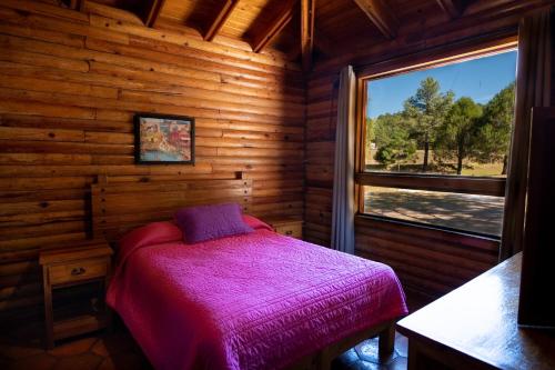 Molinillos Mountain Resort客房内的一张或多张床位