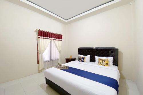 OYO 2897 Rahmah Residence Syariah客房内的一张或多张床位