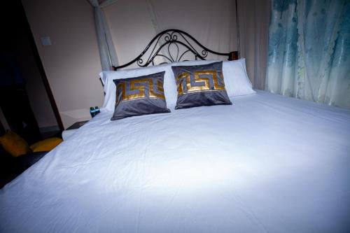 JJ Homes - Podium Heights Apartment Nairobi客房内的一张或多张床位