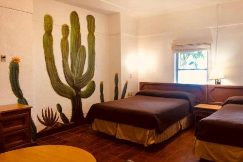 Hotel Las Palmas客房内的一张或多张床位