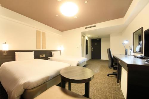 横滨公园大和鲁内酒店客房内的一张或多张床位