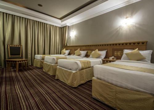 EWG Rahaf Al Mashaer Hotel客房内的一张或多张床位