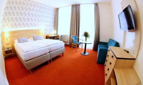 夫罗拉酒店客房内的一张或多张床位