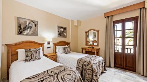 Macdonald Villacana Resort客房内的一张或多张床位