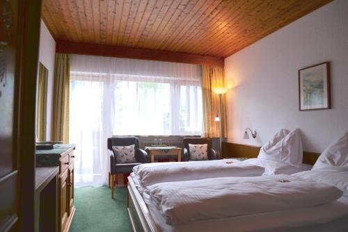 豪斯帕蒂希酒店客房内的一张或多张床位