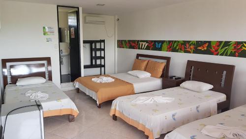Hotel y Parque Turístico Navar City客房内的一张或多张床位