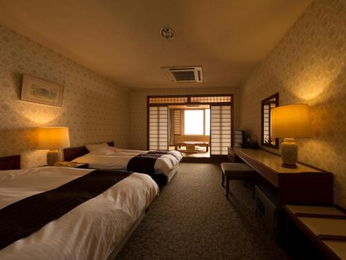 
罗驰库府邸酒店客房内的一张或多张床位
