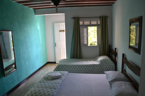 伊塔奥卡营地旅馆客房内的一张或多张床位