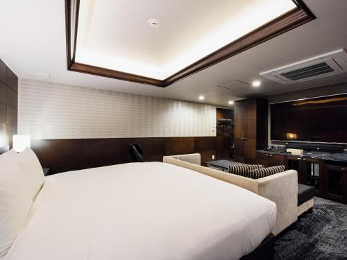Meguroholic Hotel客房内的一张或多张床位