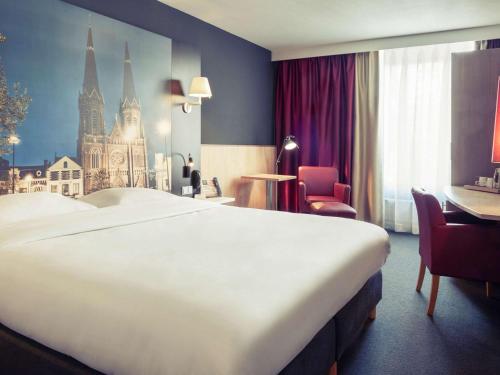 蒂尔堡中心美居酒店客房内的一张或多张床位