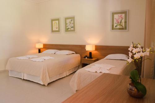 Villa de Holanda Parque Hotel客房内的一张或多张床位