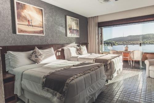 私人菲拉杜拉酒店客房内的一张或多张床位