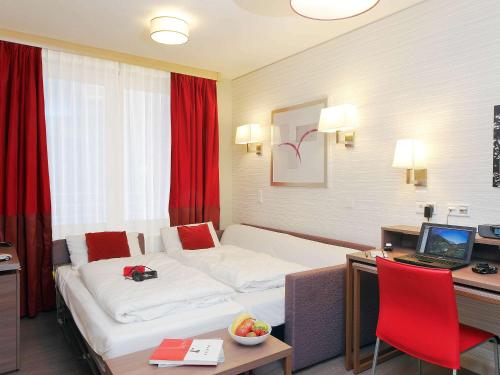慕尼黑市阿德吉奥公寓式酒店客房内的一张或多张床位