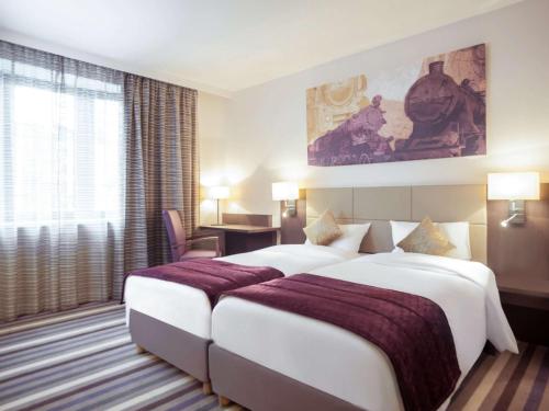 布鲁塞尔中心米迪美居酒店客房内的一张或多张床位