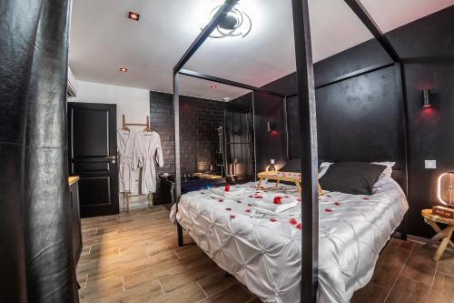 勒米尔蒙Appart Hotel GLAM88 Suites avec SPA et Sauna Privatif的相册照片