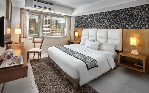 Quest Hotel & Conference Center Cebu客房内的一张或多张床位