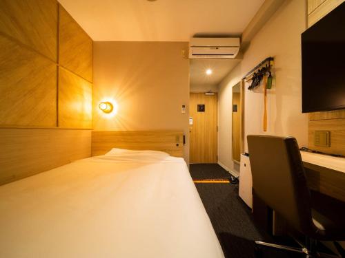 Super Hotel Nagaizumi Numazu Inter客房内的一张或多张床位