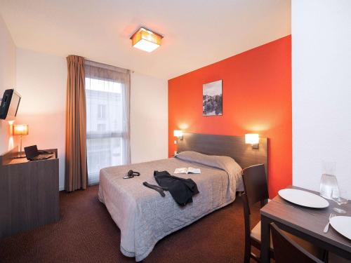 普特瑞斯爱达格公寓式酒店客房内的一张或多张床位