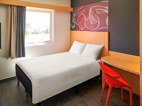 库利亚坎宜必思酒店客房内的一张或多张床位
