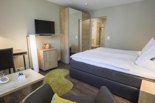 Herisau Swiss Quality Hotel客房内的一张或多张床位