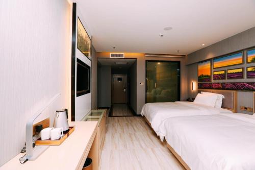 麗枫酒店·乌鲁木齐高铁万达广场店客房内的一张或多张床位