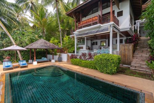 湄南海滩Napasai, A Belmond Hotel, Koh Samui的房屋前有游泳池的房子