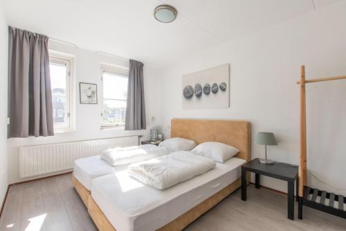 Middensluis Vakantiehuis客房内的一张或多张床位