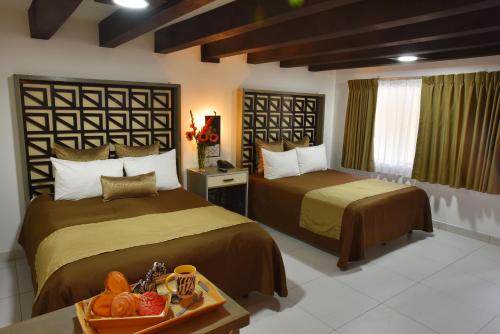 Baja Inn Hoteles Rio客房内的一张或多张床位