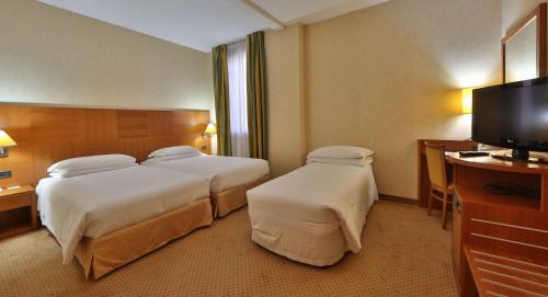 贝斯特韦斯特卡瓦利瑞德拉科洛纳酒店客房内的一张或多张床位