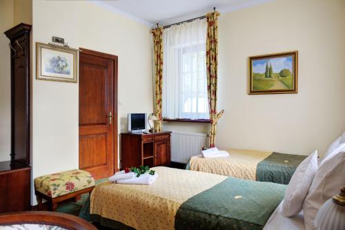 波西玛酒店别墅客房内的一张或多张床位