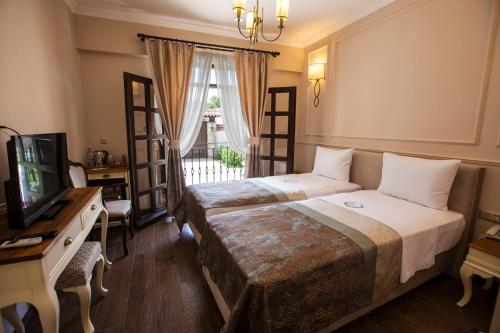 Livia Garden Hotel客房内的一张或多张床位