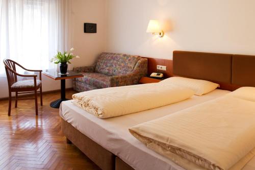Hotel Adria客房内的一张或多张床位