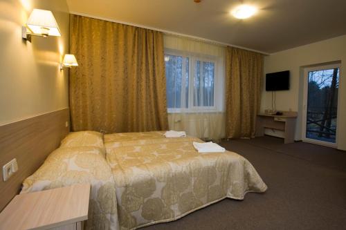 Hotel SPA Arkadia客房内的一张或多张床位